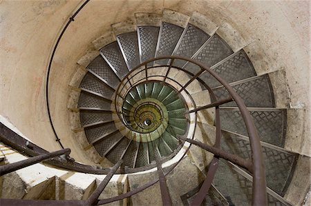 railing for stairs indoors - Spiral staircase in the Arc de Triomphe, Paris, France Stock Photo - Premium Royalty-Free, Code: 6118-07439997