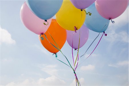 A bunch of balloons floating in the air. Stock Photo - Premium Royalty-Free, Code: 6118-07731781