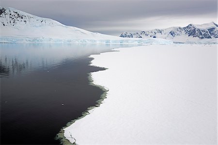 View from above, of melting sea ice off the shores of islands in Antarctica. Stock Photo - Premium Royalty-Free, Code: 6118-07731847