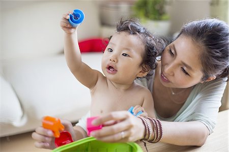 Mother playing with her baby boy. Stock Photo - Premium Royalty-Free, Code: 6118-07808998