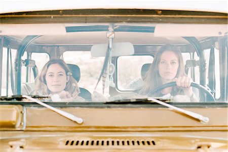 simsearch:6118-08140197,k - Two women on an outing in the desert, driving in a 4x4. Stock Photo - Premium Royalty-Free, Code: 6118-08140180