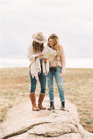 simsearch:6118-08140197,k - Two women standing in a desert, studying a map. Stock Photo - Premium Royalty-Free, Code: 6118-08140210