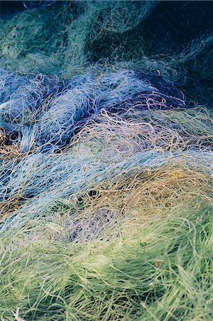 simsearch:6118-08910527,k - Pile of commercial fishing nets Stock Photo - Premium Royalty-Free, Code: 6118-08399653