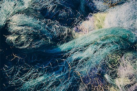 simsearch:6118-08910527,k - Pile of commercial fishing nets Stock Photo - Premium Royalty-Free, Code: 6118-08399654
