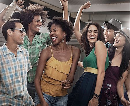 simsearch:6118-08140197,k - A group of friends, men and women hanging out together, partying. Stock Photo - Premium Royalty-Free, Code: 6118-08488095