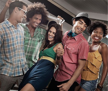 simsearch:6118-08140197,k - A group of friends, men and women hanging out together, partying. Stock Photo - Premium Royalty-Free, Code: 6118-08488096
