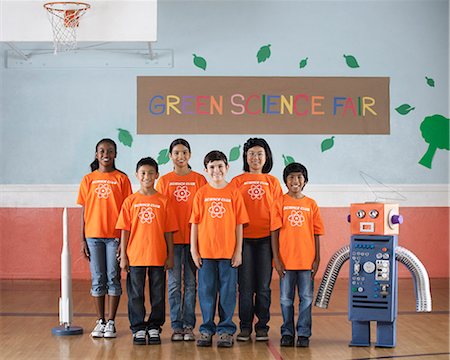 spaceship - Students in the Science Club standing under the sign Green Science Fair with a rocket and a model robot made from steel tubes and cardboard. Stock Photo - Premium Royalty-Free, Code: 6118-08488234