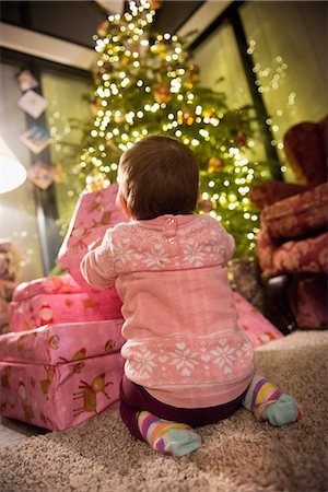 decoration christmas house - A toddler beside a pile of presents under a Christmas tree. Stock Photo - Premium Royalty-Free, Code: 6118-08488461