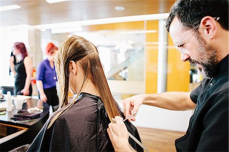 simsearch:6118-08660009,k - A hair stylist with a client, cutting her long straight hair. Stock Photo - Premium Royalty-Free, Code: 6118-08660206