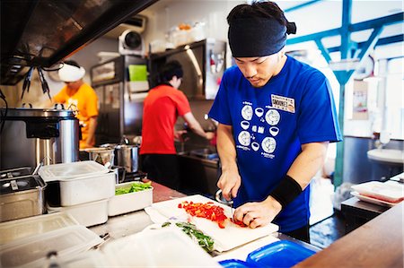 The ramen noodle shop. Three chefs working in a small kitchen, staff preparing food Stock Photo - Premium Royalty-Free, Code: 6118-08761682