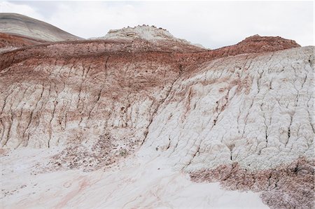 simsearch:6118-07353866,k - The Bentonite hills, coloured rock strata and formations of the Cainville Wash in Capitol Reef national park in Utah. Stock Photo - Premium Royalty-Free, Code: 6118-08947921