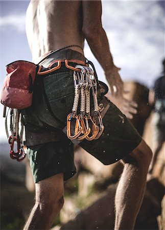 simsearch:6118-09039107,k - Close up of a mountaineer wearing rope, carabiners, and carabiners on his belt. Stock Photo - Premium Royalty-Free, Code: 6118-08991341