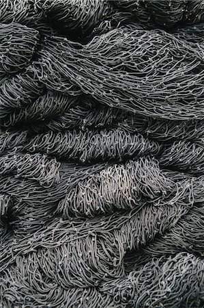 simsearch:6118-08910527,k - Close up of a pile of tangled up commercial fishing nets. Foto de stock - Sin royalties Premium, Código: 6118-08910514