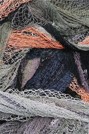 simsearch:6118-08910527,k - Close up of a pile of tangled up commercial fishing nets. Foto de stock - Sin royalties Premium, Código: 6118-08910518