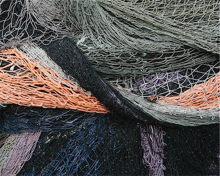simsearch:6118-08910527,k - Close up of a pile of tangled up commercial fishing nets. Foto de stock - Sin royalties Premium, Código: 6118-08910520