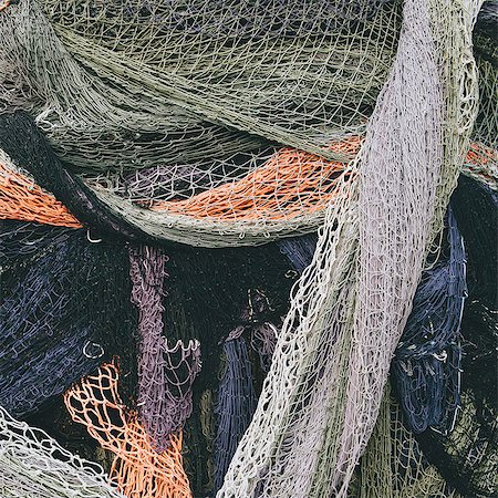 simsearch:6118-08910527,k - Close up of a pile of tangled up commercial fishing nets. Foto de stock - Sin royalties Premium, Código: 6118-08910521