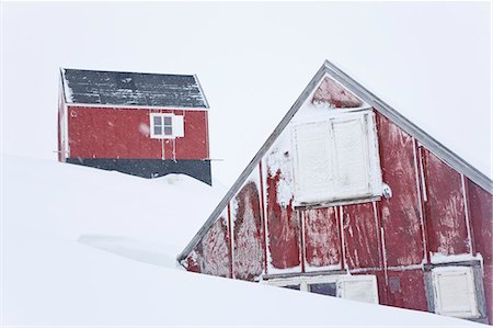 Winter landscape with two red wooden cottages on a hill. Stock Photo - Premium Royalty-Free, Code: 6118-09076512