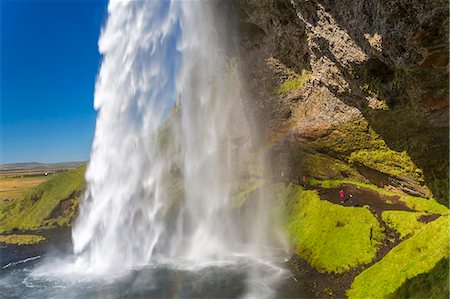 A waterfall cascade over a sheer cliff. Foto de stock - Sin royalties Premium, Código: 6118-09076539