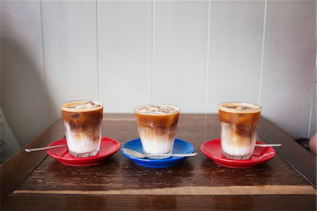 simsearch:859-06538435,k - Close up of three iced coffees in glasses on a table. Stock Photo - Premium Royalty-Free, Code: 6118-09018606