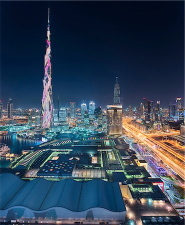 simsearch:649-07710289,k - Cityscape of Dubai, United Arab Emirates at dusk, with illuminated Burj Khalifa skyscraper in the foreground. Stock Photo - Premium Royalty-Free, Code: 6118-09028252