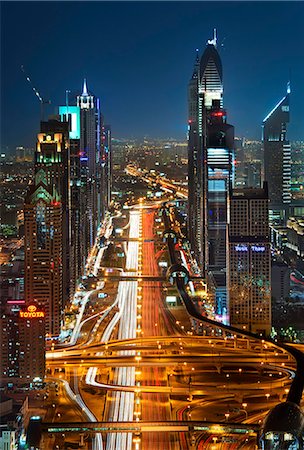 simsearch:649-07710299,k - Cityscape with skyscrapers and illuminated road in Dubai, United Arab Emirates at dusk. Stock Photo - Premium Royalty-Free, Code: 6118-09028255