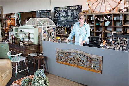 simsearch:6118-08202525,k - Caucasian woman owner of an antique store standing near the cash register Stock Photo - Premium Royalty-Free, Code: 6118-09148044