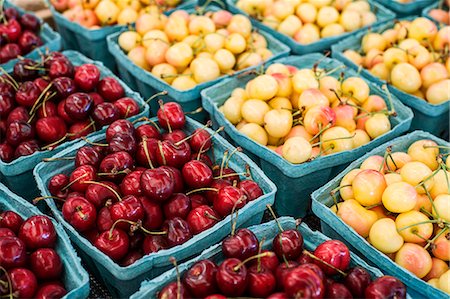 simsearch:614-06169178,k - High angle close up of punnets with fresh red and yellow cherries at a fruit and vegetable market.at a fruit and vegetable market. Stock Photo - Premium Royalty-Free, Code: 6118-09148104