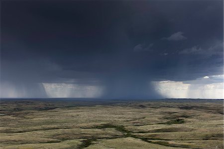 Dark storm clouds of over Grasslands National Park, Saskatchewan, Canada. Stock Photo - Premium Royalty-Free, Code: 6118-09173785