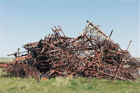 simsearch:694-03328729,k - Pile of discarded farming equipment in rural landfill, near Kildeer, Saskatchewan, Canada. Stock Photo - Premium Royalty-Free, Code: 6118-09173815