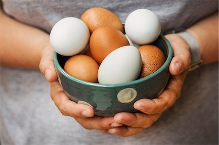 simsearch:6118-08521776,k - A woman holding bowl with fresh brown and white eggs. Stock Photo - Premium Royalty-Free, Code: 6118-09112114