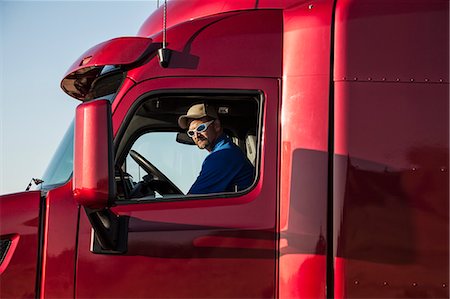 side view of man in truck - Portrait of a Caucasian man, a truck driver and truck owner. Stock Photo - Premium Royalty-Free, Code: 6118-09139557