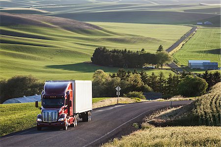 Commercial truck driving though wheat fields of eastern Washington, USA at sunset. Stock Photo - Premium Royalty-Free, Code: 6118-09139504
