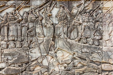 Bas-relief carvings in Bayon Temple in Angkor Thom, Angkor, UNESCO World Heritage Site, Siem Reap Province, Cambodia, Indochina, Southeast Asia, Asia Stock Photo - Premium Royalty-Free, Code: 6119-07451408
