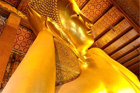 Head of the large reclining Buddha, Wat Phra Chetuphon (Wat Pho) (Wat Po), founded in the 17th century, the oldest temple in the city, Bangkok, Thailand, Southeast Asia, Asia Stock Photo - Premium Royalty-Free, Code: 6119-07452348