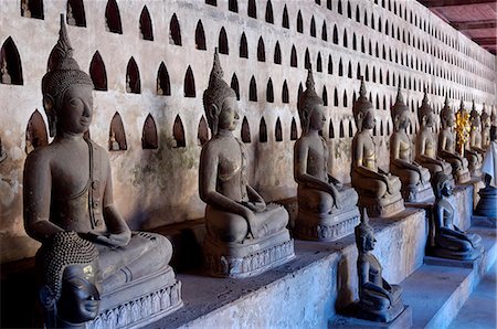simsearch:841-06341159,k - Buddha statues in the cloister or gallery surrounding the Sim, Wat Sisaket, Vientiane, Laos, Indochina, Southeast Asia, Asia Stock Photo - Premium Royalty-Free, Code: 6119-07452326