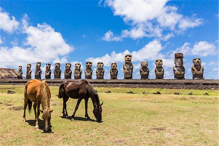 statue of horse - Horses grazing at the 15 moai restored ceremonial site of Ahu Tongariki on Easter Island (Isla de Pascua) (Rapa Nui), UNESCO World Heritage Site, Chile, South America Stock Photo - Premium Royalty-Free, Code: 6119-07587371