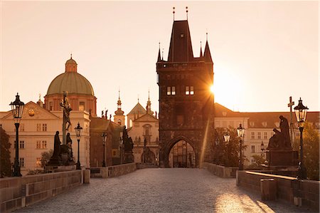 Old Town Bridge Tower and Charles Bridge at sunrise, UNESCO World Heritage Site, Prague, Bohemia, Czech Republic, Europe Stock Photo - Premium Royalty-Free, Code: 6119-07587402