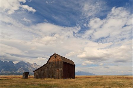 Mormon Row barn under a big sky in autumn (fall), Antelope Flats, Grand Teton National Park, Wyoming, United States of America, North America Stock Photo - Premium Royalty-Free, Code: 6119-07734981