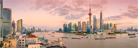 places of asia - Pudong skyline across Huangpu River, including Oriental Pearl Tower, Shanghai World Financial Center and Shanghai Tower, Shanghai, China, Asia Stock Photo - Premium Royalty-Free, Code: 6119-07735089