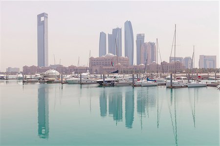 City skyline looking towards the Emirates Palace Hotel and Etihad Towers, Abu Dhabi, United Arab Emirates, Middle East Stock Photo - Premium Royalty-Free, Code: 6119-07845355