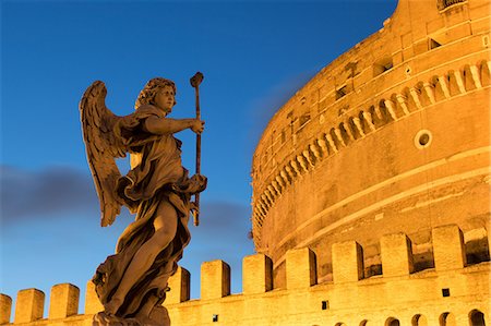 roman - Angel statue on Ponte Sant' Angelo bridge at dusk with Castel Sant' Angelo, Rome, Lazio, Italy, Europe Stock Photo - Premium Royalty-Free, Code: 6119-07943929