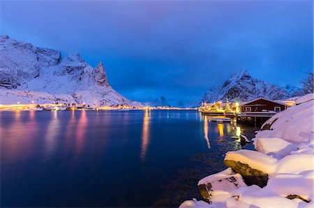 simsearch:6119-07443725,k - Blue hour in the small bay of Reine, where the lights of the houses reflect in the calm water surrounding the Lofoten Islands, Arctic, Norway, Scandinavia, Europe Stock Photo - Premium Royalty-Free, Code: 6119-08062123
