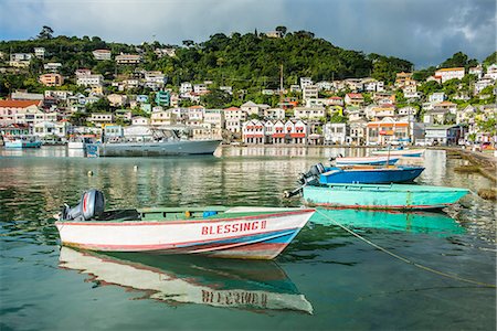 Little motoboat in the inner harbour of St. Georges, capital of Grenada, Windward Islands, West Indies, Caribbean, Central America Stock Photo - Premium Royalty-Free, Code: 6119-08062368