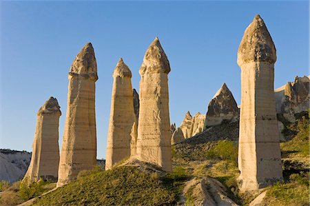 fairy chimney - Phallic pillars known as fairy chimneys in the valley known as Love Valley near Goreme in Cappadocia, Anatolia, Turkey, Asia Minor, Eurasia Stock Photo - Premium Royalty-Free, Code: 6119-08269359