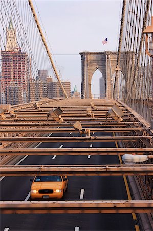 Taxi crossing Brooklyn Bridge, New York City, New York, United States of America, North America Stock Photo - Premium Royalty-Free, Code: 6119-08269464