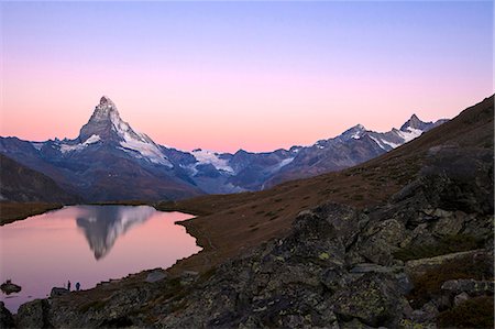 pennine alps - Pink sky at sunrise on the Matterhorn reflected in Stellisee, Zermatt, Canton of Valais, Pennine Alps, Swiss Alps, Switzerland, Europe Stock Photo - Premium Royalty-Free, Code: 6119-08211373