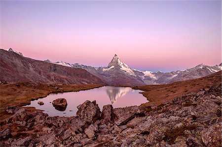 pennine alps - Pink sky at sunrise on the Matterhorn reflected in Stellisee, Zermatt, Canton of Valais, Pennine Alps, Swiss Alps, Switzerland, Europe Stock Photo - Premium Royalty-Free, Code: 6119-08211377