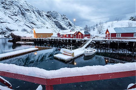 simsearch:841-08244166,k - Cold sea and snowy peaks frame the fishing village at dusk, Nusfjord, Nordland, Lofoten Islands, Northern Norway, Scandinavia, Europe Stock Photo - Premium Royalty-Free, Code: 6119-08797205