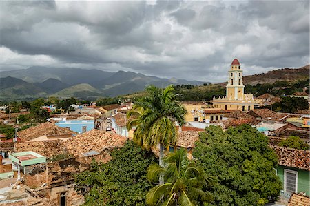 An elevated view of the terracotta roofs and the bell tower of the Museo Nacional de la Lucha, formerly Iglesia y Convento de Sa, Trinidad, UNESCO World Heritage Site, Sancti Spiritus Province, Cuba, West Indies, Caribbean, Central America Stock Photo - Premium Royalty-Free, Code: 6119-08703736