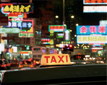 simsearch:700-02723081,k - Taxi sign and neon lights at night on Nathan Road, Kowloon, Hong Kong, China, Asia Stock Photo - Premium Royalty-Free, Code: 6119-08739887